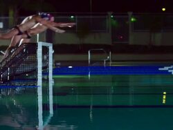 WS SLO MO Waterpolo team diving into swimming pool / Riverside, California, United States Stock Footage