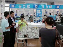 MS Salesman talking with customer in trade shows / Xian, Shaanxi, China Stock Footage
