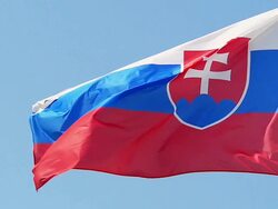 MS SLO MO Shot of Slovakia Flag Waving in Wind / Caen, Normandy, France Stock Footage