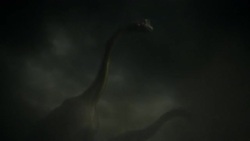 Rocks and other debris engulf dinosaurs, killing them in a computer generated animation. Stock Footage