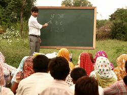 Teacher teaching to rural people, Haryana, India Stock Footage