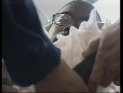 GWT: VOICED Wounded coalition soldiers being treated on ship News Clip