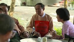 Win Myint sat chatting to others News Clip