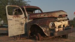 A derelict truck rusts in the Namib Desert. Stock Footage