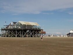WS View of cafÃƒÂ© and boy playing with beach kite, North Sea North Frisia, / St. Peter Ording, Schleswig Holstein, Germany Stock Footage