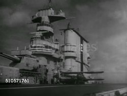1930: US NAVY AIRCRAFT CARRIER: WS Carrier at sea w/ biplane flying past, VS Biplanes taking off from flight deck, signalman using flag, HA WS Biplane taking off, leaving ship deck. Instructional Video