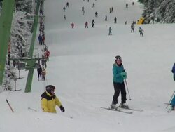 WS Shot of skier and snowboarder on piste, winter sport and snow ski lift / Erbeskopf, Hunsruck, Rhineland Palatinate, Germany Stock Footage