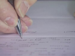 Man writing very close up, USA Stock Footage