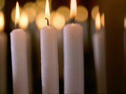T/L - CU candles burning down, black background, flame Stock Footage