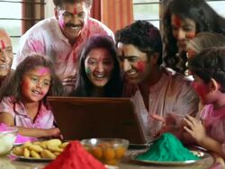 Family celebrating holi festival on the laptop Stock Footage
