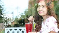 Young woman sitting for drink beverages Stock Footage