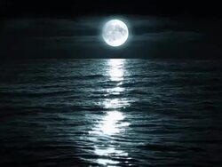 Moon over the sea, loopable Stock Footage