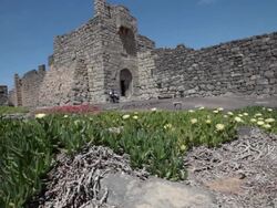 Qasr al-Azraq is one of the desert castles, located on the outskirts of present-day Azraq, roughly 100 km (62 mi) east of Amman. Stock Footage