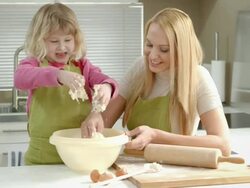 HD DOLLY: Mother And Daughter Kneading The Dough Stock Footage