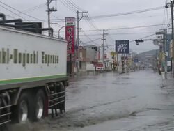 Destruction caused by tsunami after magnitude 9 Tohoku earthquake, north east Japan, March 2011. Truck drives through tidal flooding in Ishinomaki, Miyagi Prefecture after tsunami Stock Footage