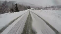 Winter driving on a slippery road Stock Footage