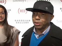 Bono and Damien Hirst Paint the Town Red For Aids In Africa - The (RED) Auction Stock Footage