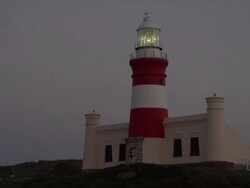 MS LA View of Lighthouse at night / Cape Agulhas, Western Cape, South Africa Stock Footage