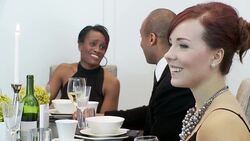 Guests at a dinner party chat Stock Footage