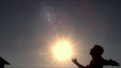 Wideshot of male soccer player kicking ball over his head (silhouette) Stock Footage