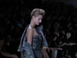 Designer departs from gowns to deliver daywear News Clip