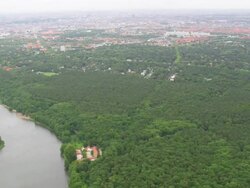 WS AERIAL ZI View of city skyline with forest at Grunewald / Germany Stock Footage