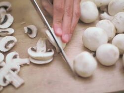 Cook cutting mushrooms Stock Footage
