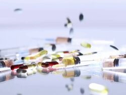 HD SLOW MOTION: Medicaments Falling On Syringes Stock Footage
