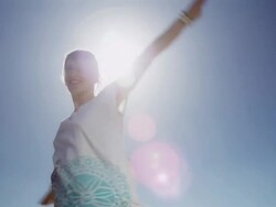 Woman spinning on beach Stock Footage
