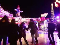 MS TS Shot of People entering and leaving amusement ride at funfair, flying bobs / Cologne, Germany Stock Footage