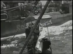 1945: JAPAN SURRENDER WORLD WAR II: VS USS Missouri battleship at sea, Japanese harbor pilot being transferred to USS Missouri from accompanying ship. INT VS Japanese officers & United States officers looking over map of Tokyo Bay. WWII, 'Big Mo' Instructional Video