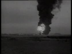B/W 1960's wide shot of explosion on air base / Vietnam / SOUND Stock Footage