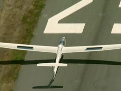 2010 AERIAL Glider flying over suburbs and and landing on runway / Santiago de Chile, Gran Santiago, Chile Stock Footage