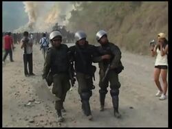 Protesters close roads, burn police station after clashing with police News Clip