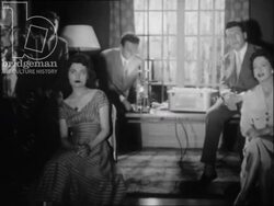 Home cinema projecting footage in a living room, made in France, 1956 Stock Footage