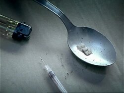CU, heroin on spoon, syringe and lighter on table top, Ljubljana, Slovenia Stock Footage