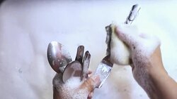 white bubble woman hand slow motion shot cleaning spoon close up Stock Footage
