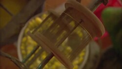 Spools pull silk threads from silk cocoons that boil in a kettle. Stock Footage