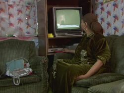 MS Shot of interior of family life in small apartment, women switching off television / Cairo, Egypt Stock Footage