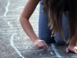 MS TD Girl drawing hopscotch with colored chalk on sidewalk  / Langley, British Columbia, Canada.           Stock Footage