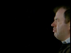 High Speed Sneeze, side view man's head sneezing, black background, lips wobble and saliva flies out of mouth Stock Footage