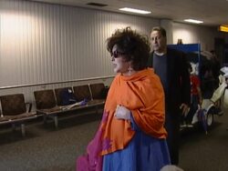 Liz Taylor arrives to be made Dame and worries about 'red eyes' Stock Footage