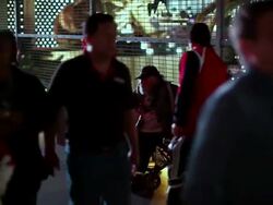 WS  Man sitting in wheelchair on city  walkway as people pass / Las Vegas,Nevada,USA Stock Footage