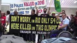 CLEAN : Welcome to Hell protesting Rio police tell tourists News Clip