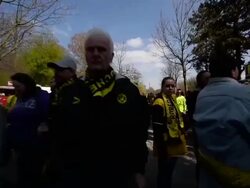 Tracking shot of fans walking towards stadium Stock Footage