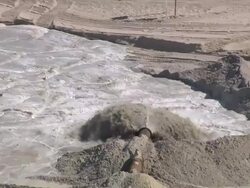 CU AERIAL View of water blowind through pipe in force / Sylt, Schleswig-Holstein, Germany Stock Footage