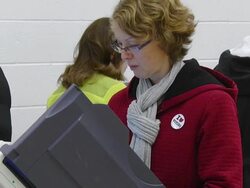 MS Shot of female voter casts ballot at copmuter terminal during voting in presidential election / Sylvania, Ohio, United States  Stock Footage