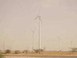 Wind turbine on desert, Jaisalmer, Rajasthan, India Stock Footage