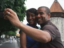 couple taking a self portrait by a river Stock Footage
