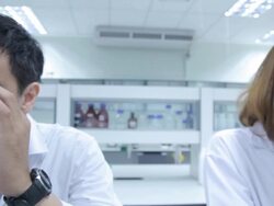 HD : Scientist Couple using microscope Stock Footage